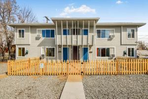 a house with a wooden fence in front of it at Premier Stay Near Casinos with King Beds & Entertainment in Reno