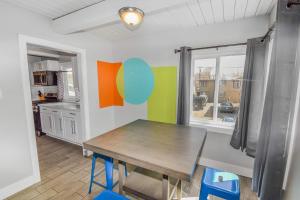 a dining room with a table and a kitchen at Premier Stay Near Casinos with King Beds & Entertainment in Reno +24 photos