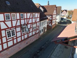 an empty street in a town with buildings at Zur goldenen Krone Pension Stadtallendorf in Stadtallendorf