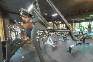 a man in a gym with several machines at TUK Tulum Studios in Tulum