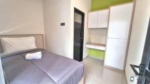 Ένα ή περισσότερα κρεβάτια σε δωμάτιο στο Suite 7 Guest House Jimbaran