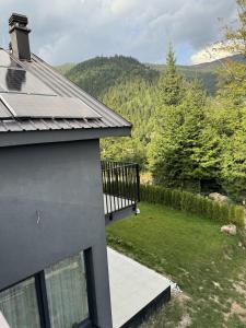 a view of a yard from a house at Charming House Near Hajla Peak - Rugove in Peje