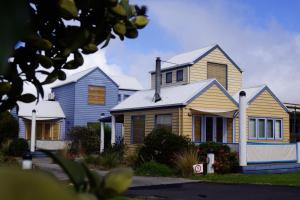 a row of houses in a residential neighbourhood at Rayville Boat Houses in Apollo Bay