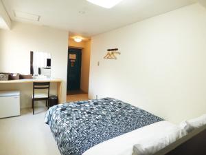 Vuode tai vuoteita majoituspaikassa Kyoto Uraraka Guest House
