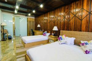 Postel nebo postele na pokoji v ubytování Mornington Hotel Sitiawan