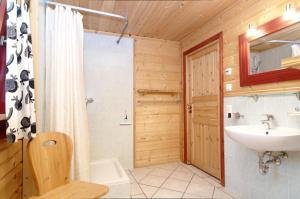 a bathroom with a sink and a toilet and a shower at Galå Fjällgård in Galåbodarna