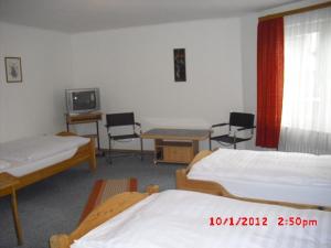 Postel nebo postele na pokoji v ubytování Hotel Feilen-Wolff