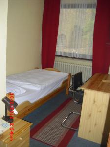 Postel nebo postele na pokoji v ubytování Hotel Feilen-Wolff