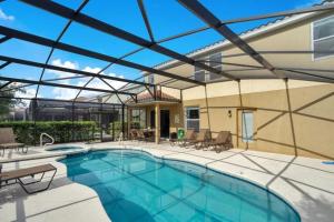 a swimming pool with a retractable roof at 5259-6-WW-Pool&SPA Lazy River&Slides in Davenport