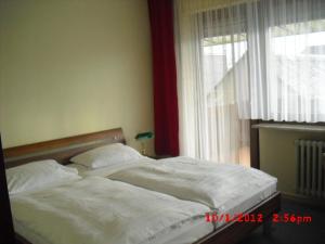 Postel nebo postele na pokoji v ubytování Hotel Feilen-Wolff