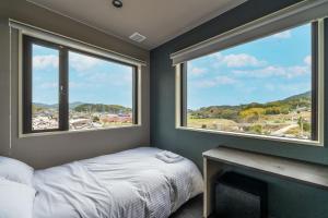 Postel nebo postele na pokoji v ubytování HOTEL Tsmart