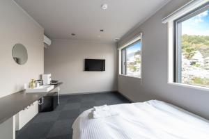 Postel nebo postele na pokoji v ubytování HOTEL Tsmart