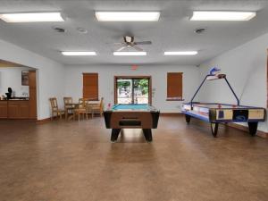 a room with two ping pong tables in it at 2BR Retreat with Stunning Mountain Views in Pigeon Forge