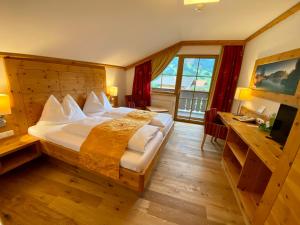 Voodi või voodid majutusasutuse Berghotel Alpenklang toas