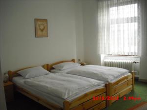 Postel nebo postele na pokoji v ubytování Hotel Feilen-Wolff