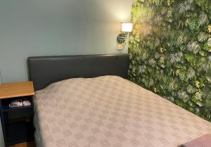 A bed or beds in a room at Öko Kemping és Glamping Tiszadada