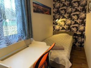 A bed or beds in a room at Öko Kemping és Glamping Tiszadada
