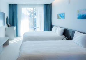 Hotel Sollavue客房内的一张或多张床位