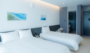 Hotel Sollavue客房内的一张或多张床位