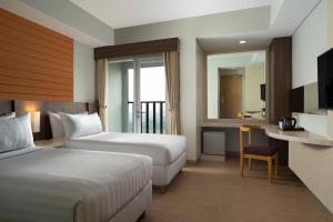 Vuode tai vuoteita majoituspaikassa Vega Hotel Gading Serpong