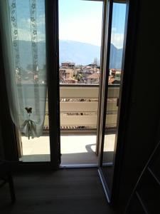 an open door to a balcony with a view at Mary House in Ossimo +8 photos