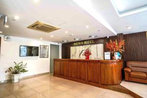 a hotel lobby with a reception desk and a waiting room at Arima Hotel Nha Trang Beach by HC Group in Nha Trang