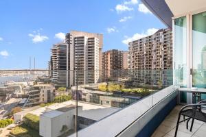 a balcony with a view of a city at Harbourfront Urban Oasis in Melbourne
