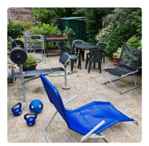 a group of chairs and a table and a ping pong ball at 21 Fairfield Crescent in Edgware