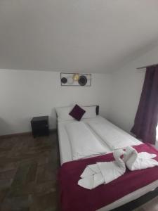Ein Bett oder Betten in einem Zimmer der Unterkunft Panda Rooms