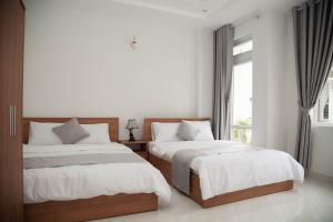 Postel nebo postele na pokoji v ubytování ALEX HOTEL Peony