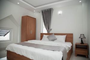 Postel nebo postele na pokoji v ubytování ALEX HOTEL Peony