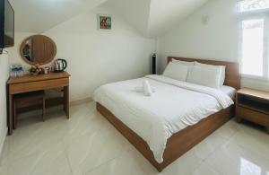 Postel nebo postele na pokoji v ubytování ALEX HOTEL Peony