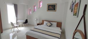 Postel nebo postele na pokoji v ubytování ALEX HOTEL Peony