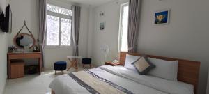 Postel nebo postele na pokoji v ubytování ALEX HOTEL Peony