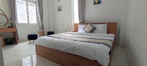 Postel nebo postele na pokoji v ubytování ALEX HOTEL Peony