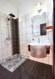 a bathroom with a sink and a shower at GoldenHill Studios&apartments in Skiathos +44 photos