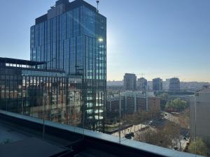 a view of a tall glass building in a city at Hs Madrid Centro Atocha in Madrid