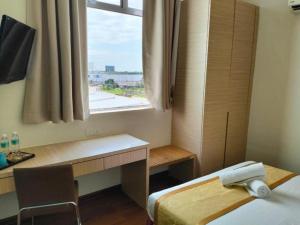Postel nebo postele na pokoji v ubytování Seeds Hotel Kuala Selangor