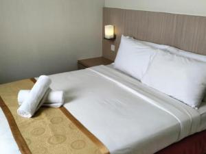 Postel nebo postele na pokoji v ubytování Seeds Hotel Kuala Selangor