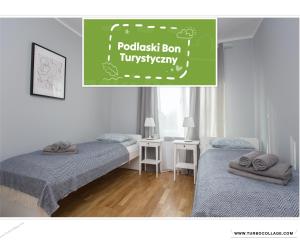 Posteľ alebo postele v izbe v ubytovaní CR Apartament Centrum Zamenhofa 1