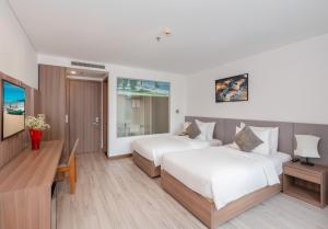 Postel nebo postele na pokoji v ubytování Gosia Hotel