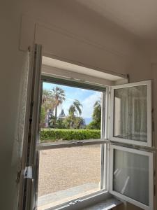 an open window with a view of the ocean at Mapa Holiday Sanremo 25 in Sanremo