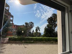 a window view of the ocean from a house at Mapa Holiday Sanremo 25 in Sanremo
