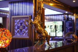 a gold statue of a horse on a counter at Safir Hotels Silivri in Silivri