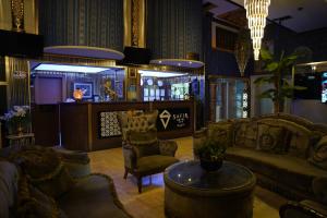 a living room with a couch and chairs and a table at Safir Hotels Silivri in Silivri