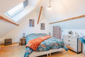 a bedroom with a bed in a attic at Elegant 120m2-Face cathedrale-6 pers-free Parking in Amiens