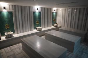 a waiting room with two benches and two windows at Safir Hotels Silivri in Silivri