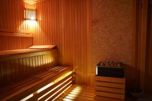 a sauna with a heater and a light in it at Safir Hotels Silivri in Silivri