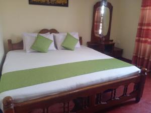 Кровать или кровати в номере Haranya Homestay