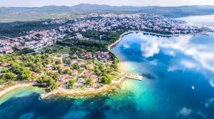 an aerial view of a small island in the water at Mobile home Pelin with shared pool in Pirovac